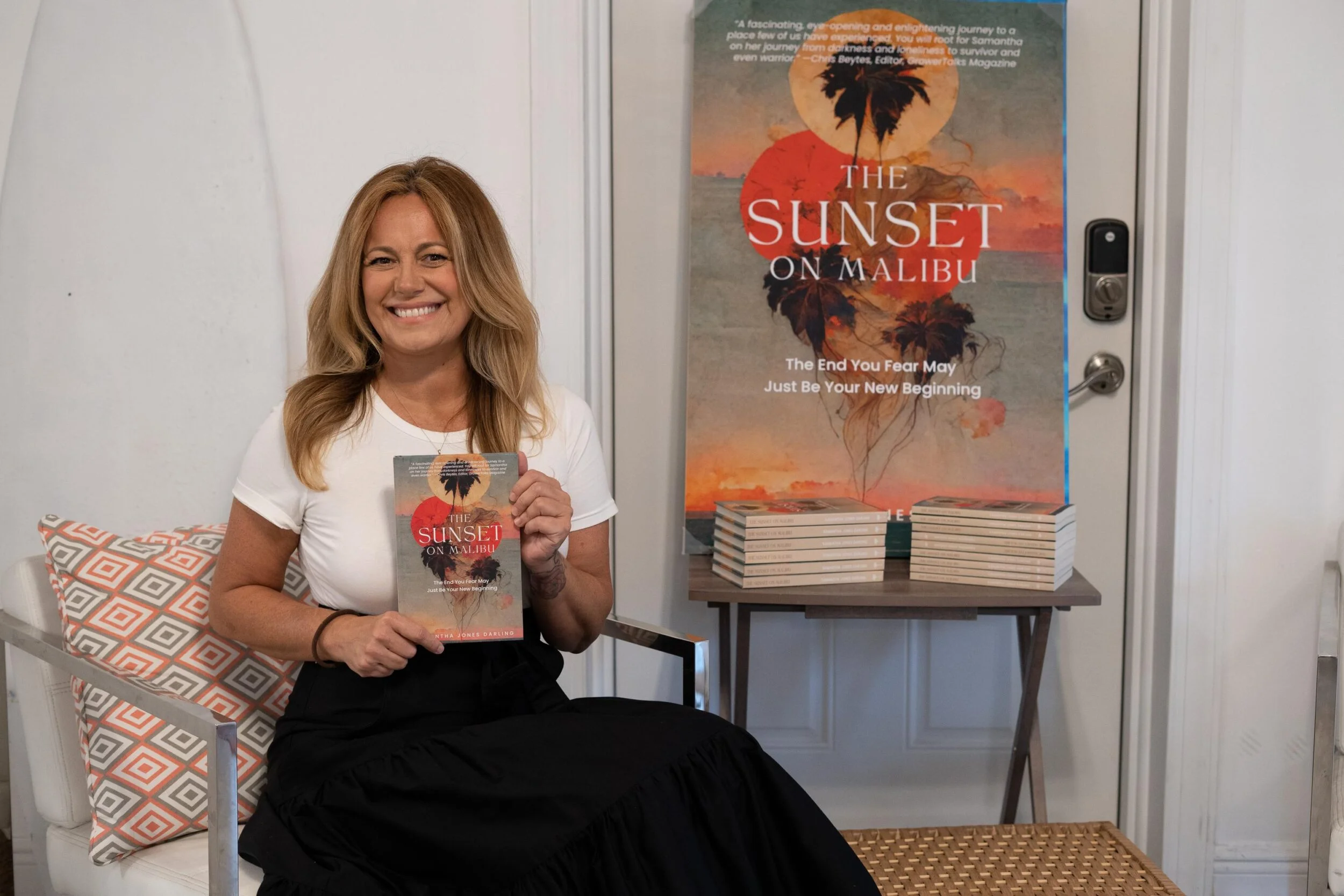 Samantha holding The Sunset on Malibu at a book launch